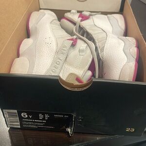 White and pink jordans